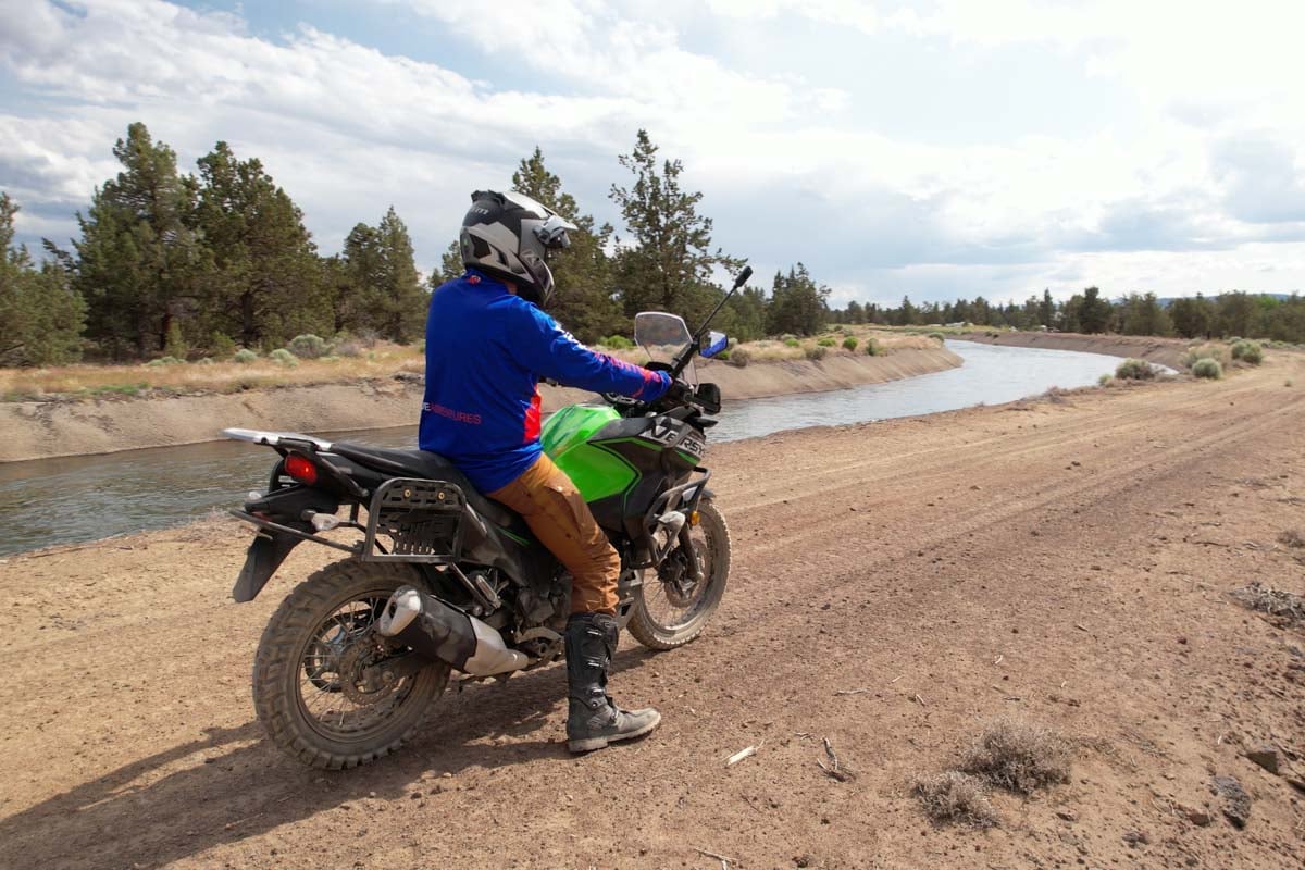 versys-x 300 looking down a trail along the canal