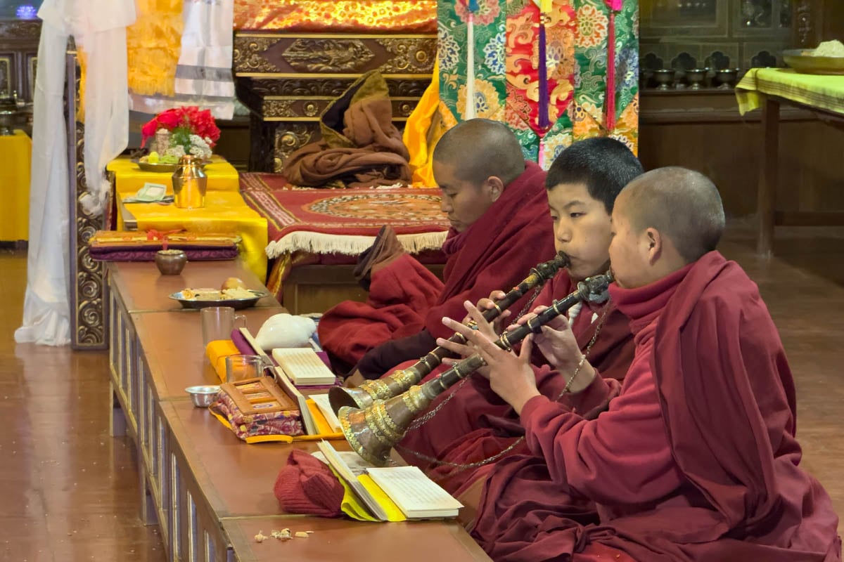 buddhist-monks-praying-and-playing-flute-nepal