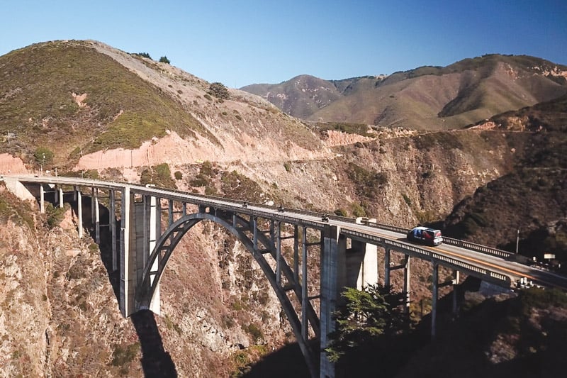 crossing-bixby-bridge-on-an-adventure-motorcycle-tour-on-the-pacific-coast-highway