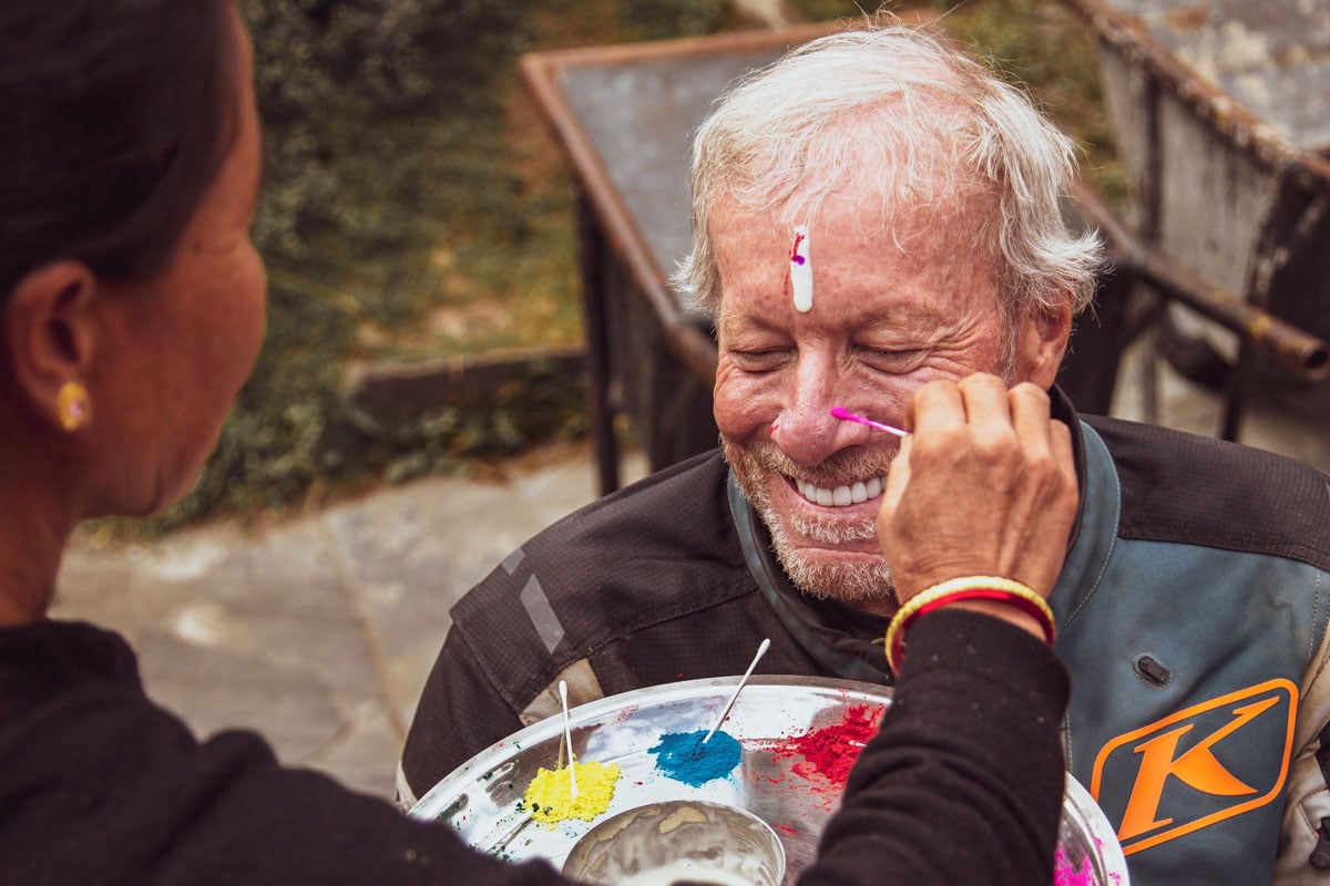 gary-getting-a-welcome-face-paint-cultural-blessing-nepal